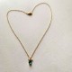 collier doré pendentif zircon bleu