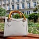 white round rattan bag